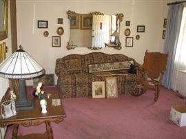 Many pictures, newer lamp, sofa, wood rocker etc