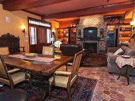 English Oak Trestle Table with Hand Hewn Stretcher & Diamond Studs along with Hob Nail Mustard Color Leather Arm Chairs


