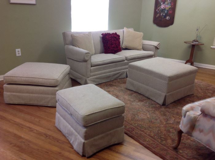 Upholstered sofa, coffee table, and ottomans