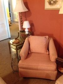 Vintage upholstered chair on rollers