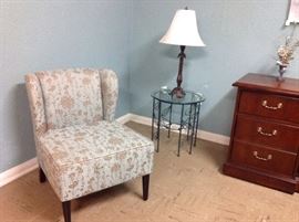 Upholstered chair, glass table