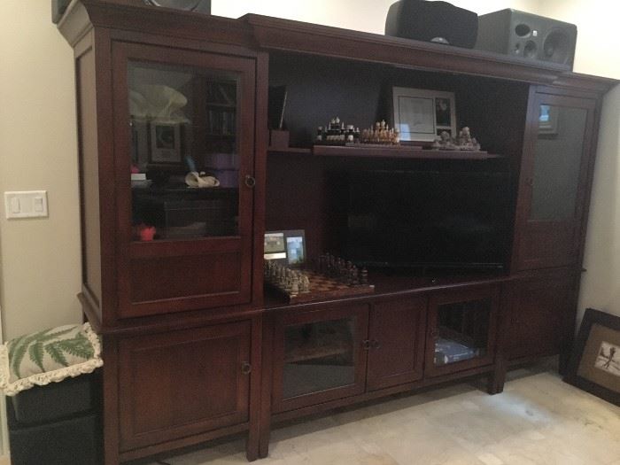 Cherry Entertainment Center with lighting in upper glass display and TV areas.  Fits 60" TV.  Abundant storage. 