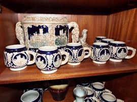 ANTIQUE METTLACH LIKE POTTERY CASTLE DESIGN PUNCH BOWL WITH PARROT SIDE HANDLES AND CUPS