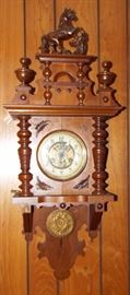 ANTIQUE GERMAN BLACK FOREST WALL CLOCK WITH BRONZE HORSE DETAIL AND DOGWOOD PATTERN