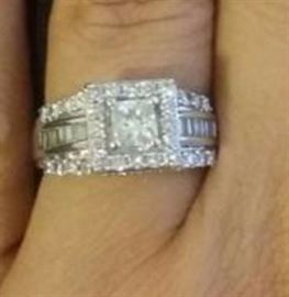 14k white gold ring with 2carat total weight princess cut diamonds. Princess and baguette cut diamonds are on the shank. The size is a 9.25 and the original retail was $6,000.00. $ 2,650.00 or best offer