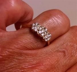 DIAMONDS INTL 14k yellow gold with a carat weight of .53 of multi round diamond with a flower design. It is a size 6. The color rating is G-H and the Clarity is SI1.