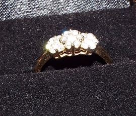 DIAMONDS INTL 14k yellow gold with a carat weight of .53 of multi round diamond with a flower design. It is a size 6. The color rating is G-H and the Clarity is SI1.