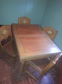 Antique inlaid table with four chairs (comes with leaf)