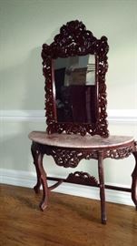 Solid Mahogany hand carved console table with matching mirror. Three available* two have had repairs to marble top