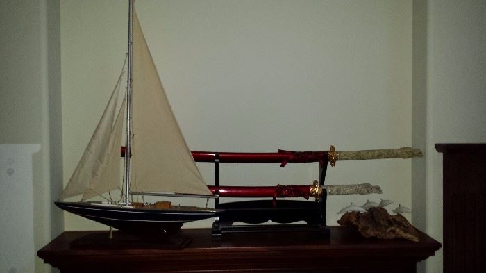 Sailboat model, Samurai swords, John Perry sculpture 