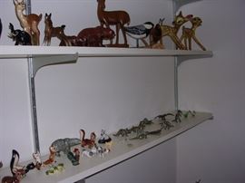 Collection of figurines includes small brass dinosaurs and wooden birds. Also Mexican Birds.