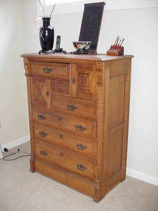 Unusual oak chest with carved doors in upper section