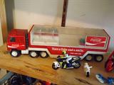 Circa 1960's Coca Cola Semi-Tractor/Trailer, steel trailer and cab with flip-top clear plastic storage for removable cases of Coca Cola, some cases missing.