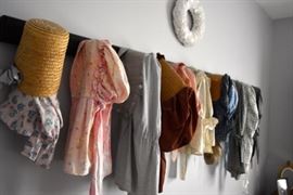 Collection of early bonnets on a hooks