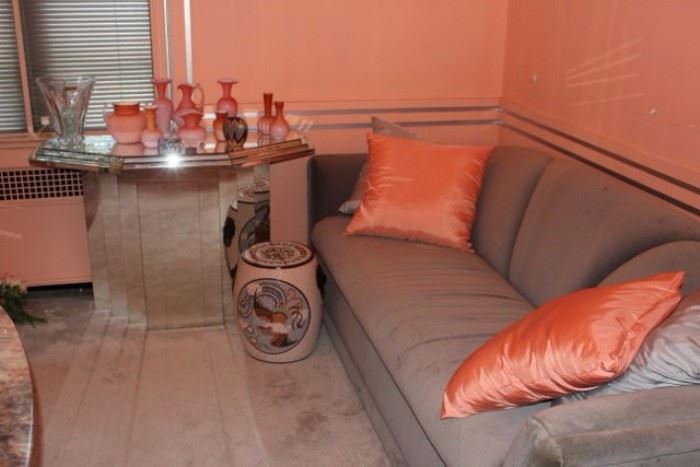 Gray Sofa, Pedestal Table & Orange, Decorative Accents
