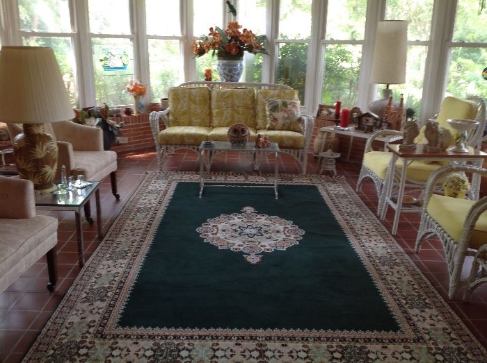 Wicker patio furniture and area rug
