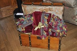 Small Antique Trunk filled with Red Velvet Drapery Panels and Valence