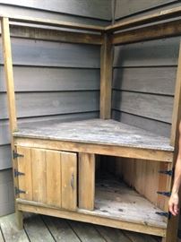 Garden work station- one door missing, hooks along the top for storage of supplies, or for drying herbs/flowers