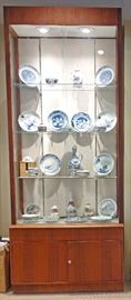 display case with Japanese and Chinese porcelains