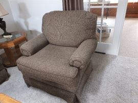 close up of chair - there are two.  The other one has an ottoman as well