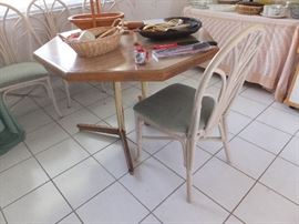 Dinette table at it's smallest size - there is 1 leaf and 4 rattan chairs