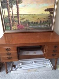wooden desk, painting, quilting frame (in box on the floor)