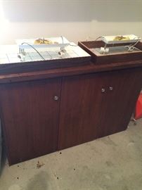 wooden storage cabinet, ceiling light fixtures laying on top