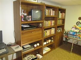 Three piece book shelves with stereo equipment and books