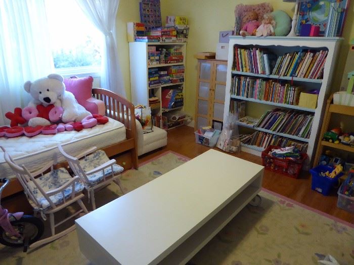 Grandkids room filled with books, games, dress-ups, doll houses, toys