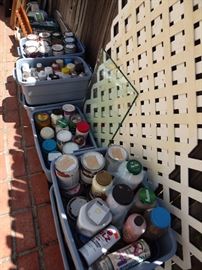Lots of cans of paints, various sizes