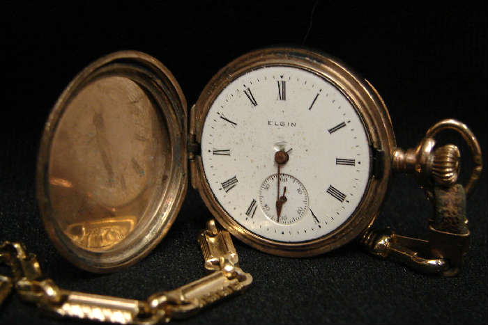 Ladies Elgin with chain, 1909, size 0s.  Gold plated case, crystal missing, not running.