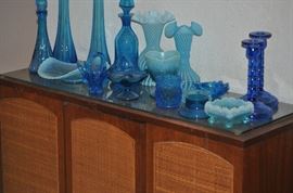 Cabinet is sold but we still have some blue glassware 