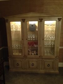3 section lighted china hutch, cupboard, French Provincial style from 1960s or 70s. Lower section contians drawers for lines and shelves, filled with Waterford Crystal and other quality glassware