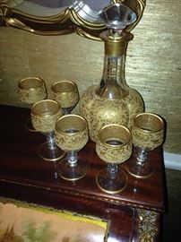Gold covered art glass cordial set