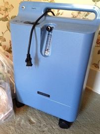 Respironics oxygen machine with tubes and supplies