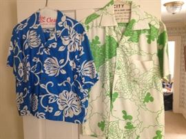 Three men's Hawaiian shirts and woman's dress all purchased in Hawaii made by island manufacturers
