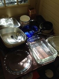 A fully stocked pantry, clear, blue and brown Pyrex, some vintage clear in silver plate holders and other vintage holders