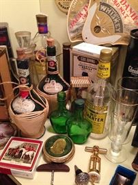 Lots of cool vintage liquor bottles, cork screws, coasters, wine stoppers, Jack Daniels fans, beer glasses
