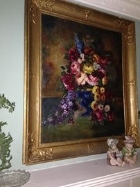Over the mantle floral still life in gilt frame