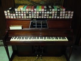 Player piano and 100 rolls, piano needs repair, or sold for parts