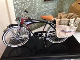 Reproduction of Indian bicycle with Plain Dealer newspapers, in acrylic display box  