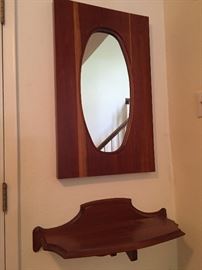 Very cool! Custom made, solid wood, wall mounted hall mirror and shelf.