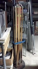 Pool sticks in rack....includes set of balls with rack, cues, chalk, 