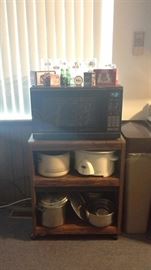 Sharp Carousel microwave, microwqve cart on wheels, Rival crockpot, stainless set of mixing bowls, stainless pot strainer, stainless pots & pans