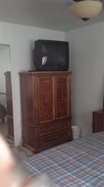 Thomasville Armoire w/2 interior drawers and 3 cubby spaces...2 bottom drawers.  Hitach television set with remotr