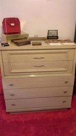 Harmony House cedar lined chest of drawers, Hamilton Collection Saturday Evening Post copper collectible, Pierre Cardin red patent leather purse, Citizens traveling clock, jewelry box from Japan