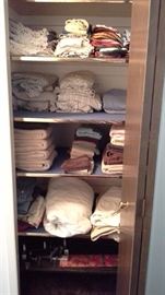 Queen bed sheets, mattress pad, bed pillows, kitchen towels, dining placemats, pot holders, canas laundry bags, over the door hooks, dollies, door draft stopper