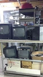 Televisions with remotes and various cables, connections and wiring