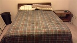 Queen sized bed with linens, headboard, matching dresser and chest of drawers