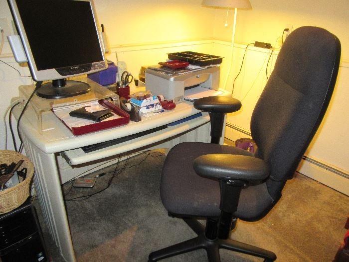 desk with chair and computer accessories